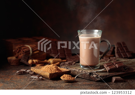 Creamy hot chocolate drink on a brown background. 123953312