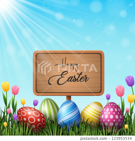 Colorful Easter eggs with wooden sign on the grass 123953534