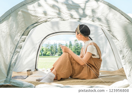 Child/girl in tent at camp 123956808