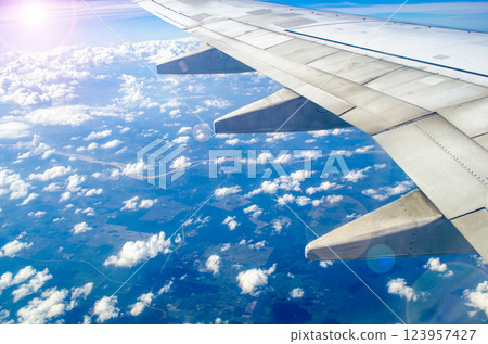 Capturing the Beauty of an Airplane Wing in Flight. Travel and holiday concept 123957427