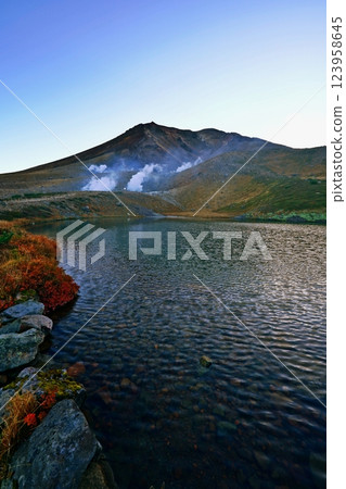 The magnificent view of the Daisetsuzan mountain range at dawn from Mount Asahidake, Sugatami Pond 123958645