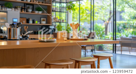 modern kitchen in smart home featuring wooden island, plants, and natural light 123959472