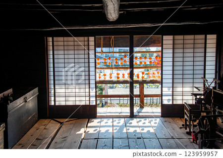(Yamanashi Prefecture) Former Takano Family Residence (Kanso Yashiki) - Persimmons under the eaves seen from the living room 123959957