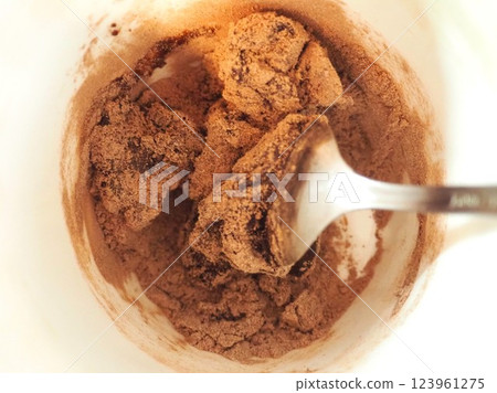 Cocoa being kneaded (center) 123961275