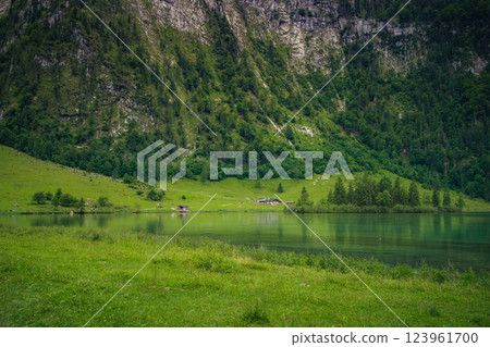 Konigssee Lake in Bavaria Germany with Church by the Lake White Boat Forested Mountain and Beautiful Sunny Trekking in Berchtesgaden German Alps. High quality photo 123961700