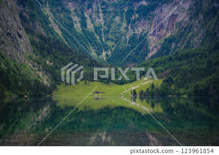 Konigssee Lake in Bavaria Germany with Church by the Lake White Boat Forested Mountain and Beautiful Sunny Trekking in Berchtesgaden German Alps. High quality photo Konigssee Lake in Bavaria Germany with Church by the Lake White Boat Forested Mountain and Beautiful Sunny Trekking in Berchtesgaden German Alps. High quality photo 123961854