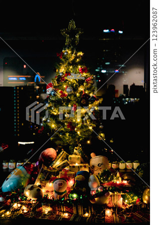 Nativity Scene with Christmas Tree and Balloon Decorations in Office Festive Atmosphere with Santa Claus. High quality photo 123962087