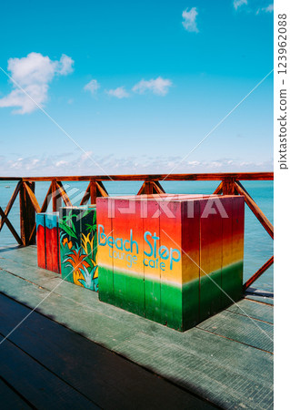 Vung Tau Beach with Blue Sky Flowers and Mother Mary Statue Scenic Coastal View with Coffee Shop Nearby High quality photo Vung Tau Beach with Blue Sky Flowers and Mother Mary Statue Scenic Coastal View with Coffee Shop Nearby High quality photo 123962088