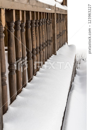 Railing veranda under the snow 123963227