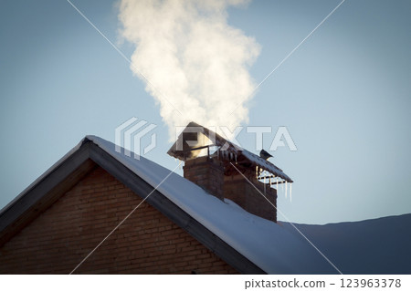 The smoke from the chimney 123963378