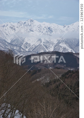 Snow-covered Northern Alps seen from Shirasawa Cave in winter 123963450
