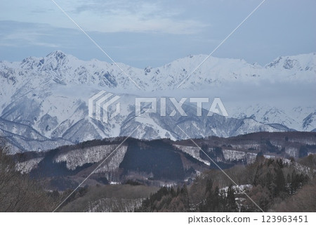 Snow-covered Northern Alps seen from Shirasawa Cave in winter 123963451