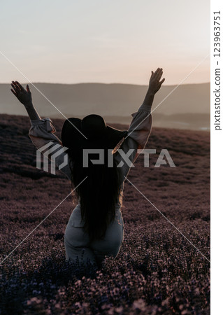 Woman in a Lavender Field at Sunset 123963751
