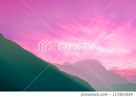 Silhouette of mountains against the pink sunset sky. Gradient color Silhouette of mountains against the pink sunset sky. Gradient color 123963884