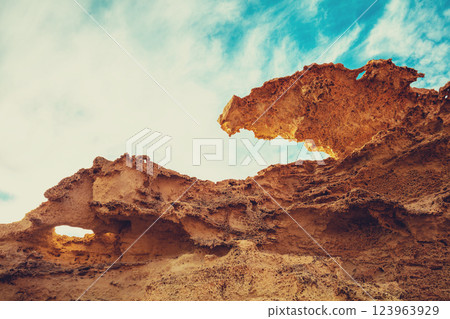 Duna Fosil de Los Escullos against a cloudy sky. Rocky landscape. Nature background 123963929
