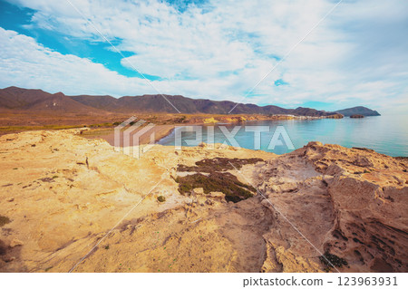 Duna Fosil de Los Escullos against a cloudy sky. Rocky landscape. Nature background 123963931