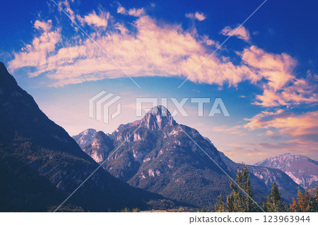 Mountain landscape background. Rocks against the evening sky. The Dolomites in South Tyrol, Italy, Europe Mountain landscape background. Rocks against the evening sky. The Dolomites in South Tyrol, Italy, Europe 123963944