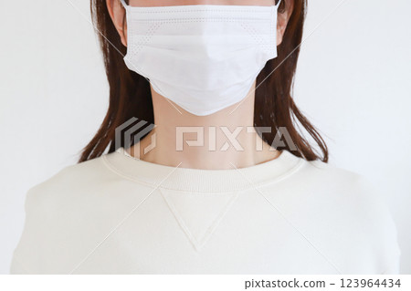 A woman wearing a mask A woman wearing a mask 123964434
