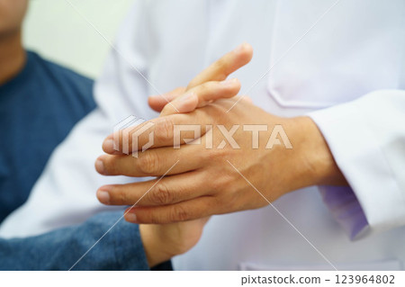 Physical therapy, Asian therapist doctor treat perform pain therapy in hospital. 123964802