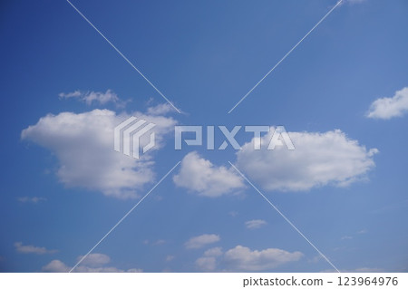 Parent and child clouds swimming in the blue sky 123964976