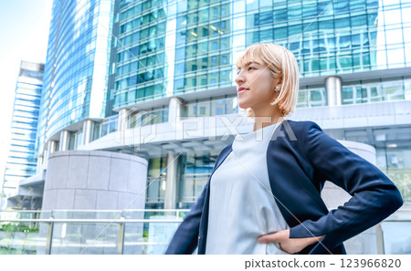 Young blonde woman and business district 123966820