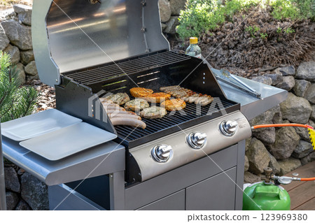 Barbecue grill bbq on propane gas grill steaks bratwurst sausages meat meal Barbecue grill bbq on propane gas grill steaks bratwurst sausages meat meal 123969380