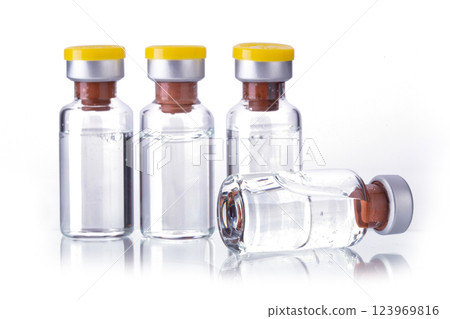 Bottle Vial of Covid-19 Coronavirus Vaccine isolated on a white background Bottle Vial of Covid-19 Coronavirus Vaccine isolated on a white background 123969816