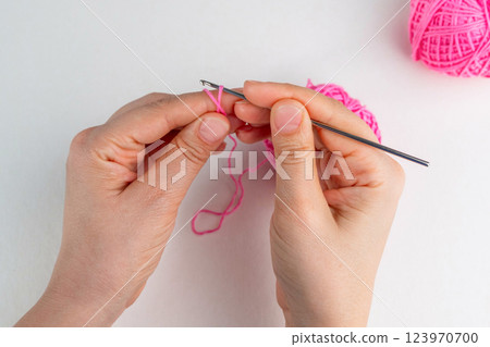 Crochet magic ring with pink yarn  123970700