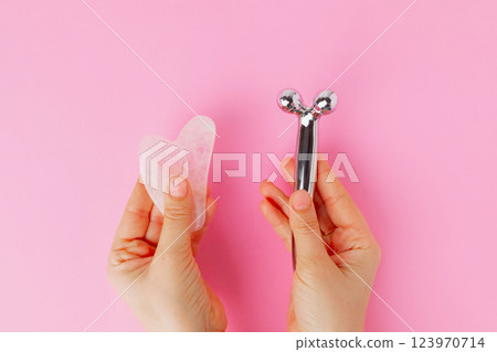 Face tools roller and quartz gua sha 123970714