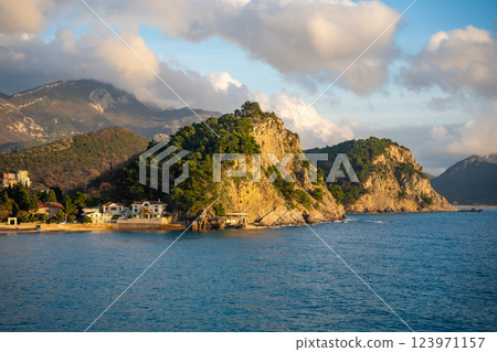 Coast landscape with rocks, sea and vegetation near ancient fort in Petrovac, Montenegro in winter time. 123971157
