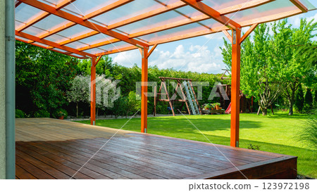 Close-up of a wooden deck - on the covered terrace - showing the process of restoration Close-up of a wooden deck - on the covered terrace - showing the process of restoration 123972198