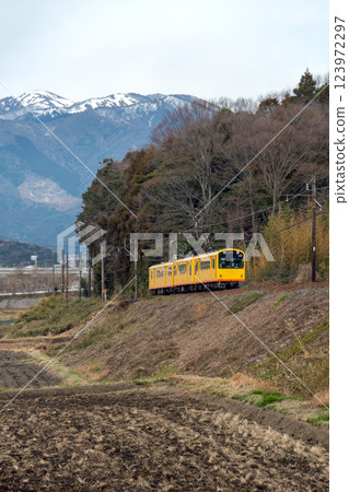 Snow-capped Suzuka Mountains and the Sangi Railway Hokusei Line 123972297