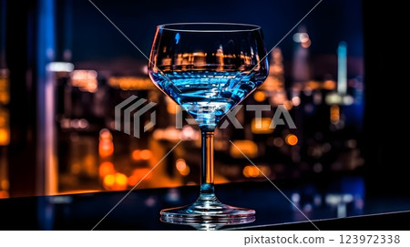 Elegant Blue Cocktail with Cityscape Backdrop Elegant Blue Cocktail with Cityscape Backdrop 123972338