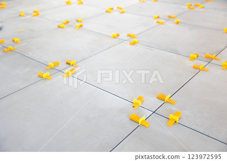 Tile leveling system ensuring perfect tile alignment during installation 123972595