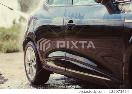 Car wash using high pressure water 123973424