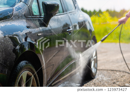 Car wash using high pressure water 123973427