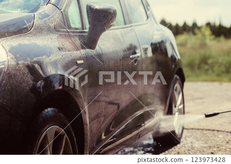 Car wash using high pressure water 123973428