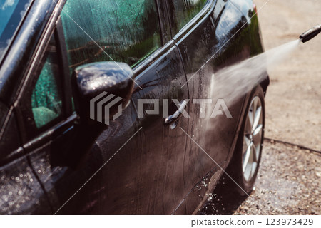 Car wash using high pressure water 123973429