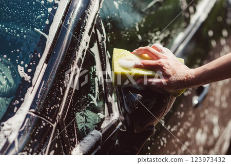 Car washing with a sponge. 123973432
