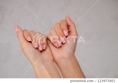 Neatly groomed nails with a natural manicure, representing self-care and beauty in a minimalist style Neatly groomed nails with a natural manicure, representing self-care and beauty in a minimalist style 123973801