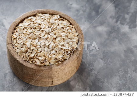 Wooden Bowl with Raw Oat Flakes On Textured Grey Background, Healthy Breakfast Ingredient, Copy Space 123974427