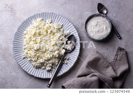 Cottage cheese on light background 123974549