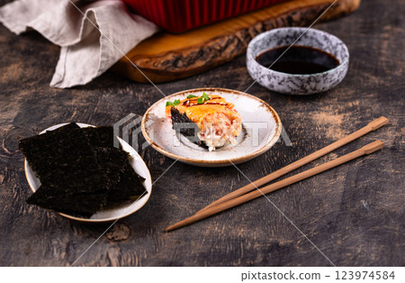 Baked sushi roll cake with crab surimi sticks 123974584