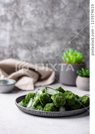 Frozen spinach green cubes in bowl Frozen spinach green cubes in bowl 123974619