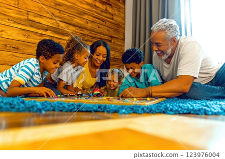 Enjoying Quality Family Bonding Time Playing Fun Games Together for Lasting Memories 123976004