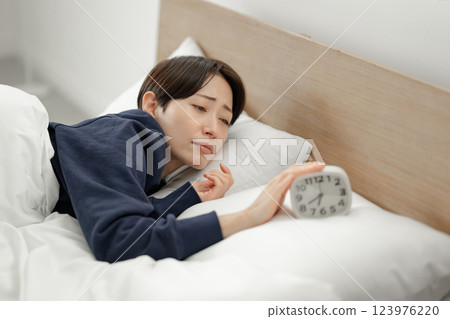 A lady who got up late A lady who got up late 123976220