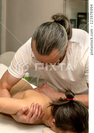 Professional massage therapist Professional massage therapist 123976994