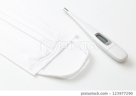 Mask and thermometer on white background Mask and thermometer on white background 123977290