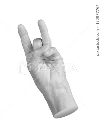 Elderly hand with index and ring fingers extended, creating a unique gesture. Pinky curled inward, Elderly hand with index and ring fingers extended, creating a unique gesture. Pinky curled inward, 123977764