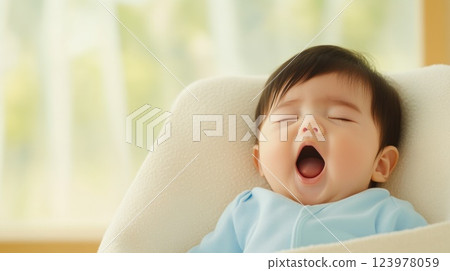 Tender moment of a yawning baby wrapped in warmth Tender moment of a yawning baby wrapped in warmth 123978059